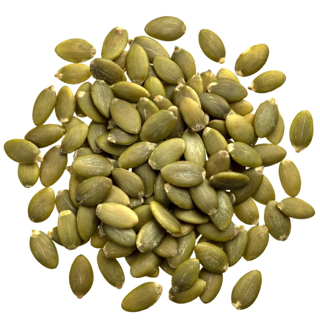 Peeled pumpkin seeds isolated on white background with clipping path, top view